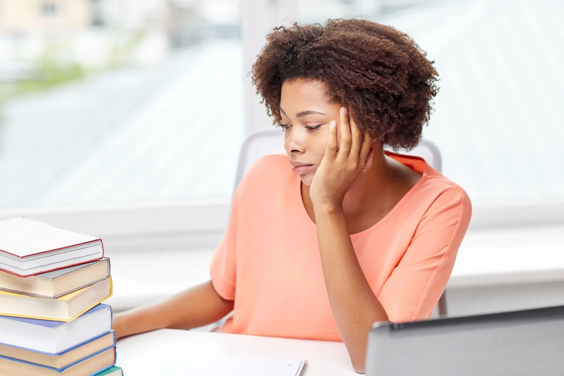 Person reviewing legal documents and notes while considering a claim against an estate during a legal consultation.